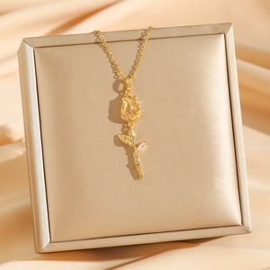 Luxurious gold tulip necklace with sparkling zircon pendant on a silk display