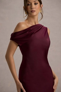 Detailed view of elegant wine red satin dress with asymmetric shoulder pleat design