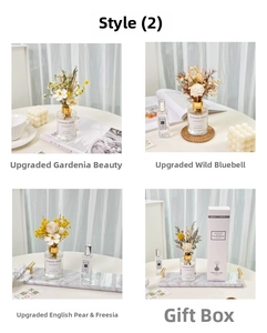 Detailed view of dried flower reed diffuser set on a marble tray with aromatic oil