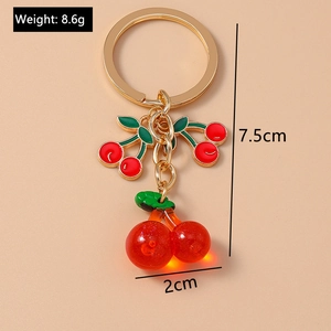 Detailed view of resin cherry keychain with 7.5cm height and 8.6g lightweight design