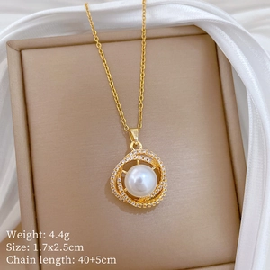 Close-up of golden pearl necklace with micro-pave crystals in a beige jewelry box