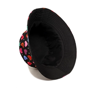 Black cotton bucket hat featuring colorful heart patterns with a white interior lining