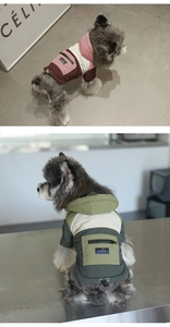 Detail of windproof pet hoodie showing zipper pocket and thermal fleece material