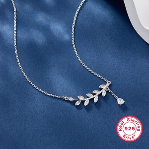 S925 Sterling Silver leaf necklace with sparkling zircon pendant on blue texture