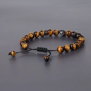 Detail of adjustable tiger eye bead bracelet with spartan helmet and braided cord