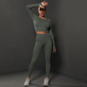 Detail of seamless scrunch yoga leggings and long sleeve crop top with thumbholes