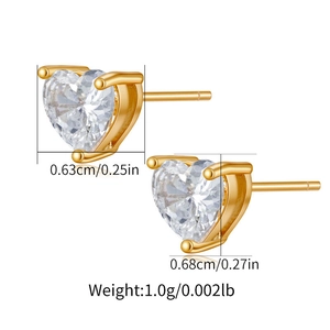 Detailed macro of heart-shaped zircon earrings in gold finish with size and weight specs
