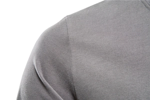 Macro shot of grey long-sleeve T-shirt showing detailed shoulder stitching and cotton texture