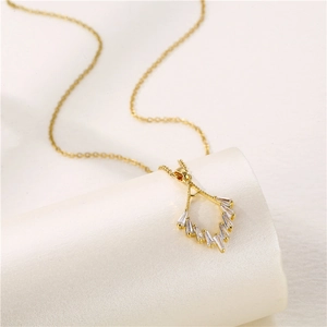 Elegant gold chain necklace with a hollow geometric pendant and inlaid zircon stones
