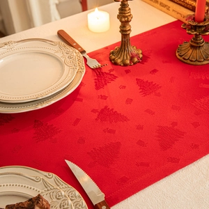 Red Christmas tree jacquard table runner with festive holiday dinner decorations
