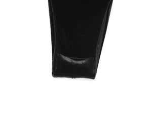 Close-up detail of black velvet bodysuit fabric with premium stitching and texture