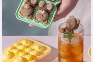 Detail of bear-shaped silicone ice cube molds with finished teddy bear ice shapes