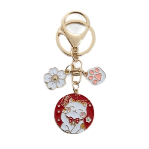 Japanese lucky cat keychain with golden metal ring and colorful enamel charms