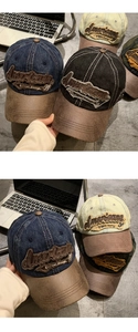 Detail of vintage denim baseball cap with leather brim and American letter embroidery