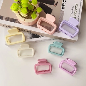 Detailed view of seven matte rectangle hair claws in soft pastel macaron colors