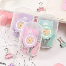 Detailed view of pastel macaron-colored stationery set with clips and bear stickers