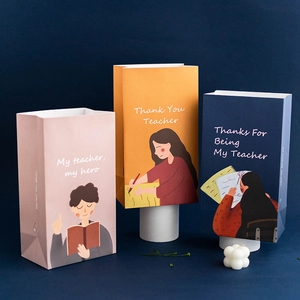 Three premium Thank You Teacher gift bags in assorted colors on a professional display pedestal