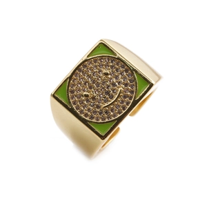 Detail shot of golden square ring featuring green enamel smiley face with zircons