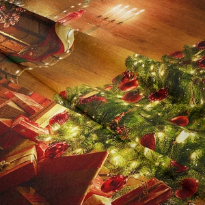 Macro shot of fine woven Christmas tapestry fabric showing festive tree and gift print