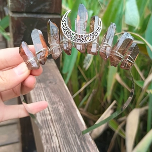 Close-up of handmade crown headband featuring smoky quartz crystals and moon charm