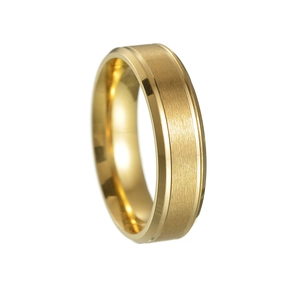 Close-up of golden brushed matte wedding band with polished beveled edges for men