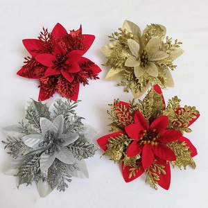 Top view of four 14cm glitter Christmas poinsettia flowers in red, gold and silver