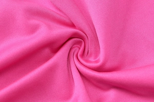 Close-up of rose red breathable honeycomb knit fabric with spiral texture detail