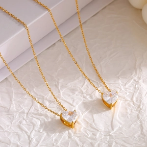 Elegant 18k gold plated heart zircon pendant necklace set on premium white paper background