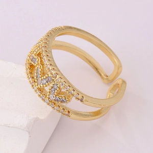 Macro shot of 18K gold plated open ring featuring pave zircon and hollow cross design
