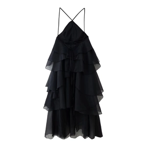 Detail of black halter neck dress with tiered ruffle layers and cross back straps