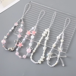 Charming beaded phone straps featuring hearts, pearls, and butterflies in four styles