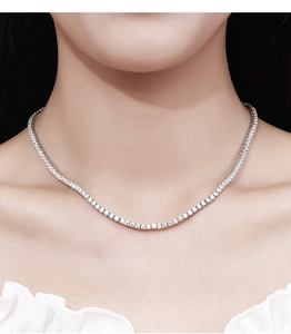 Elegant 2.5mm Moissanite tennis necklace in 925 silver worn on model's neck