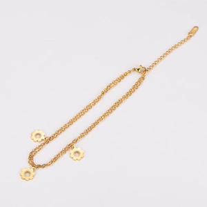 Double-layered stainless steel anklet featuring delicate gold flower charms on a white background