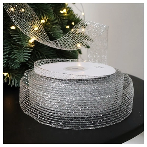 Detail of silver glitter mesh ribbon roll for Christmas tree decor and gift wrapping
