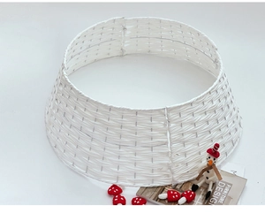 Close-up of white woven Christmas tree collar with cross-texture pattern and stable structure