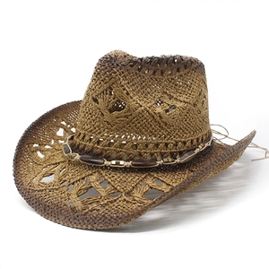 Vintage woven cowboy straw hat with decorative beaded band for beach and sun protection