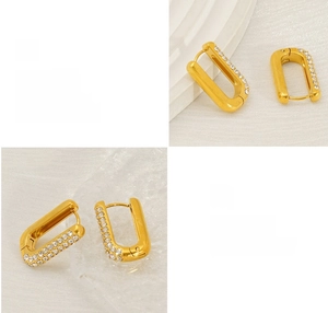 Detailed macro view of 18K gold plated hoop earrings with three rows of white zircon stones