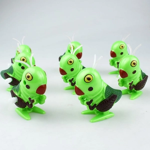 Macro detail of eight wind-up green grasshopper toys arranged in a neat grid display
