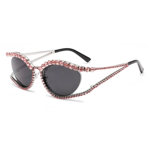 Y2K cat eye sunglasses with pink rhinestones, black lenses and hollow metal frames
