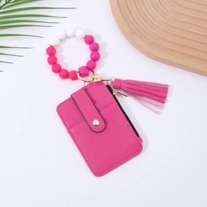 Rose pink litchi leather card holder with beaded wristlet and matching tassel