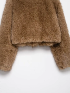 Detail of brown faux fur texture showing soft plush fabric and premium hemline finish