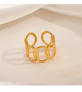 Detailed view of interconnected golden oval rings on white silk fabric background