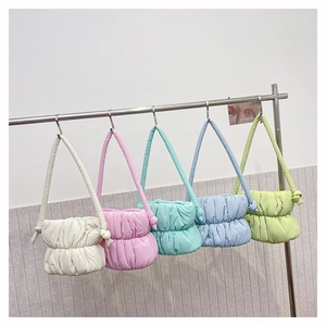 Selection of five colorful puffer bucket bags in pastel nylon with pleated texture