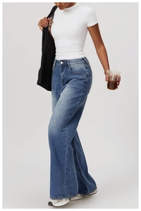 Detail of light blue high waist wide leg denim jeans paired with white slim fit sport t-shirt