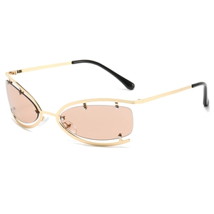 Frameless oval Y2K sunglasses with gold metal hollow frame and brown lenses