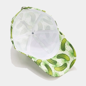Light green baseball cap with pickle and dill patterns showing inner structure and strap