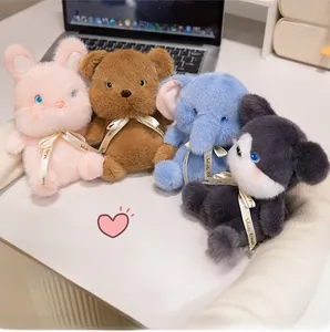 Close-up of plush rabbit, bear, and elephant toys with Woody Friends ribbons