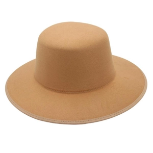 Detail showing high-density wool felt texture and ribbon edge of the camel boater hat