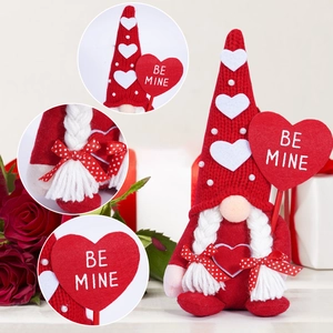 Detail of red Valentine gnome with heart patterns, braided hair and BE MINE sign