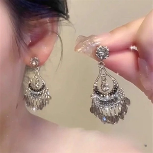 Vintage silver hollow teardrop earrings with crystals and beaded tassel charms